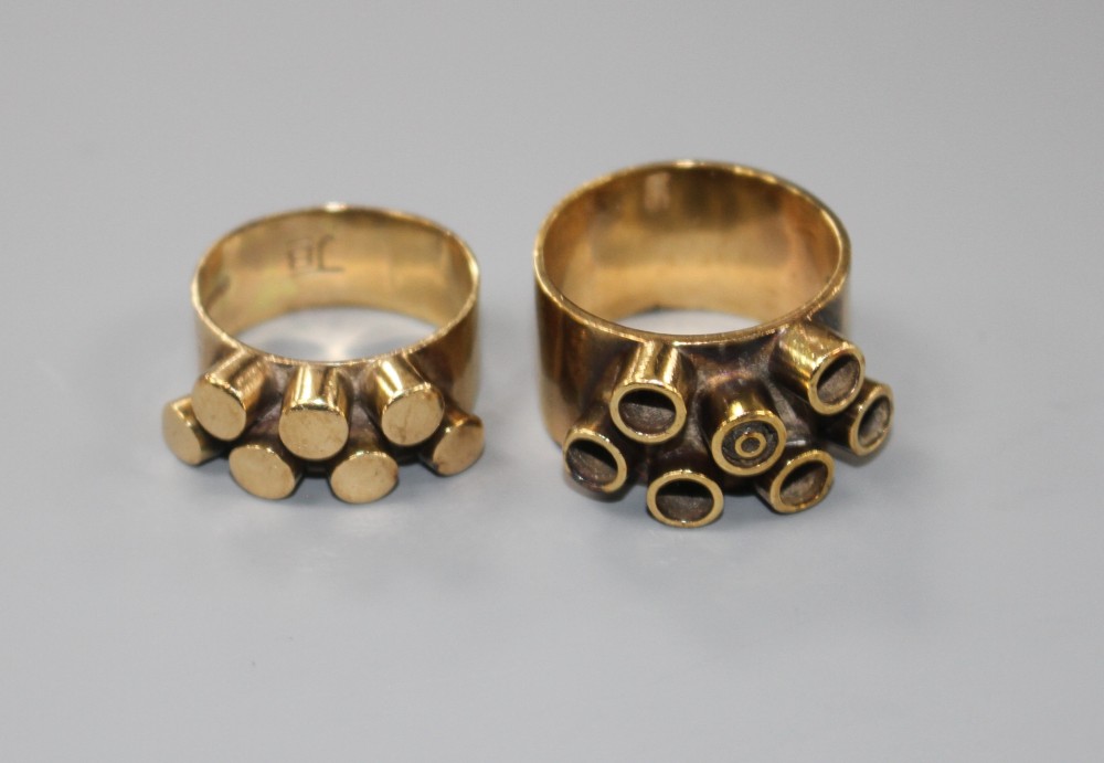 Two 1960s modernist 9ct gold dress rings, both decorated with raised cylindrical motifs, maker JB, London, 1968, sizes O and S.